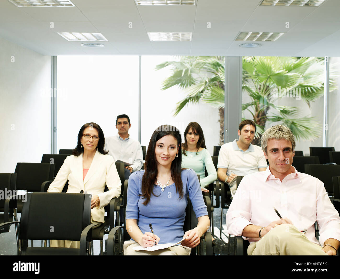 Colleagues watching presentation, portrait Stock Photo