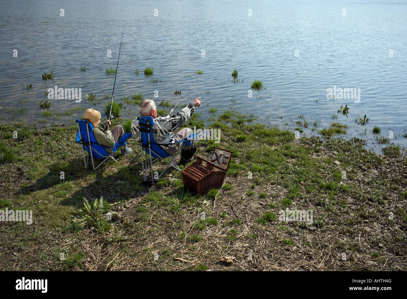 Two boys fishing in river hi-res stock photography and images - Alamy