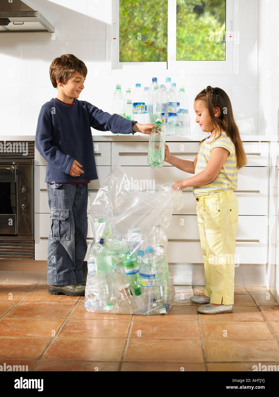 Boy recycling bottle hi-res stock photography and images - Alamy