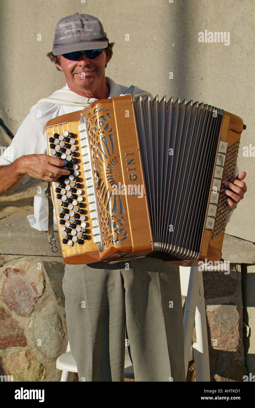 Street musician plays a Pigini Accordion for money at Port Huron