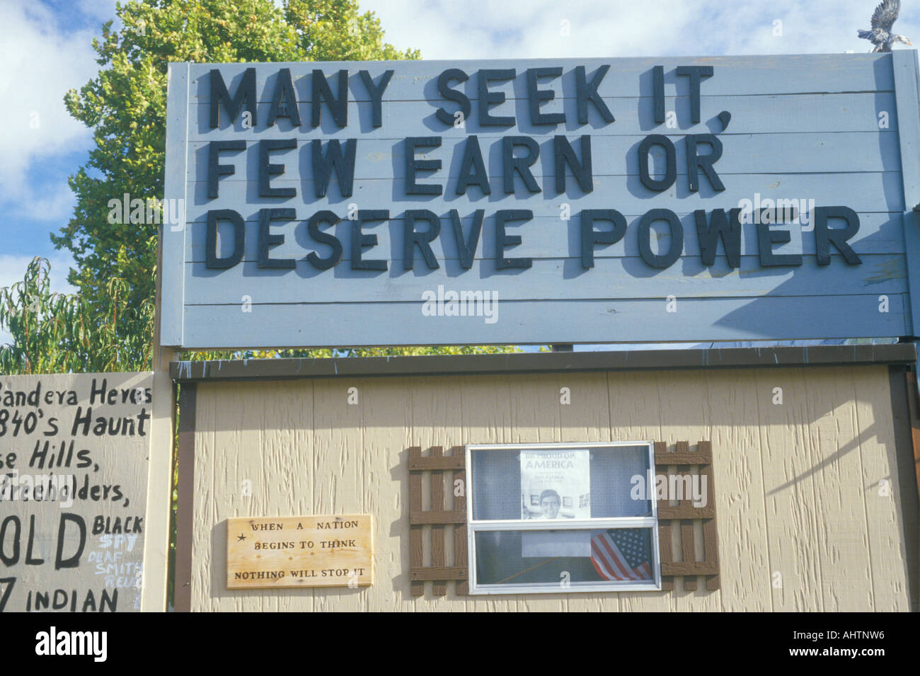 A sign that reads Many seek it few earn or deserve power Stock Photo