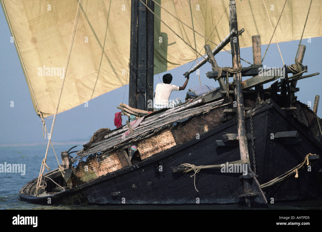 Heavily loaded river sailing barge on the Jamuna River. Bangladesh Stock Photo