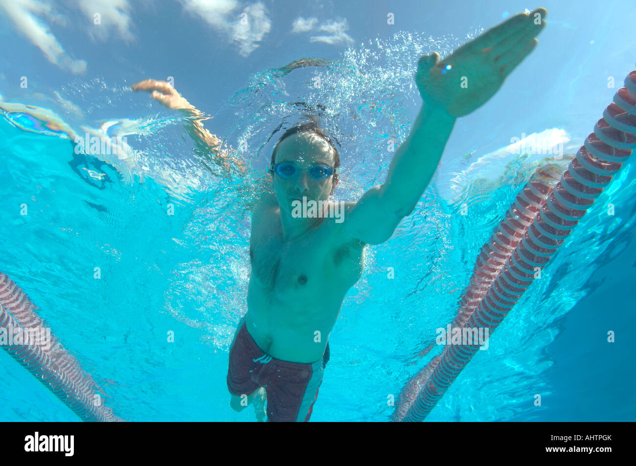 man swimming in pool Stock Photo