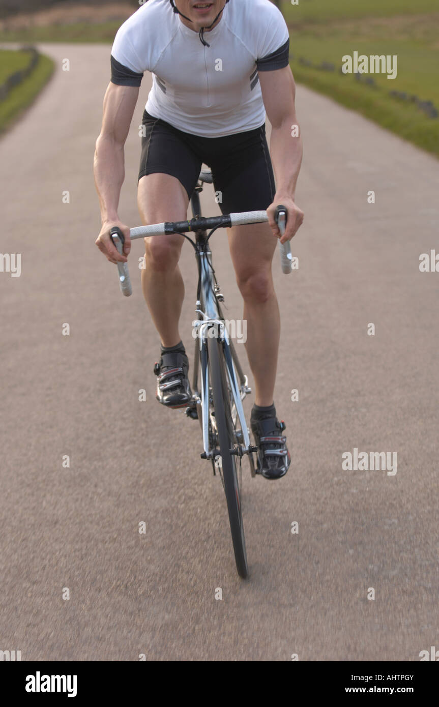 Man cycling in park Stock Photo