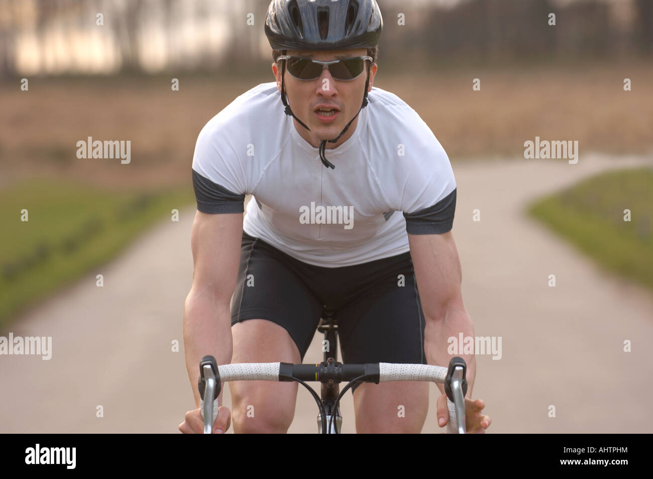 Man cycling in park Stock Photo