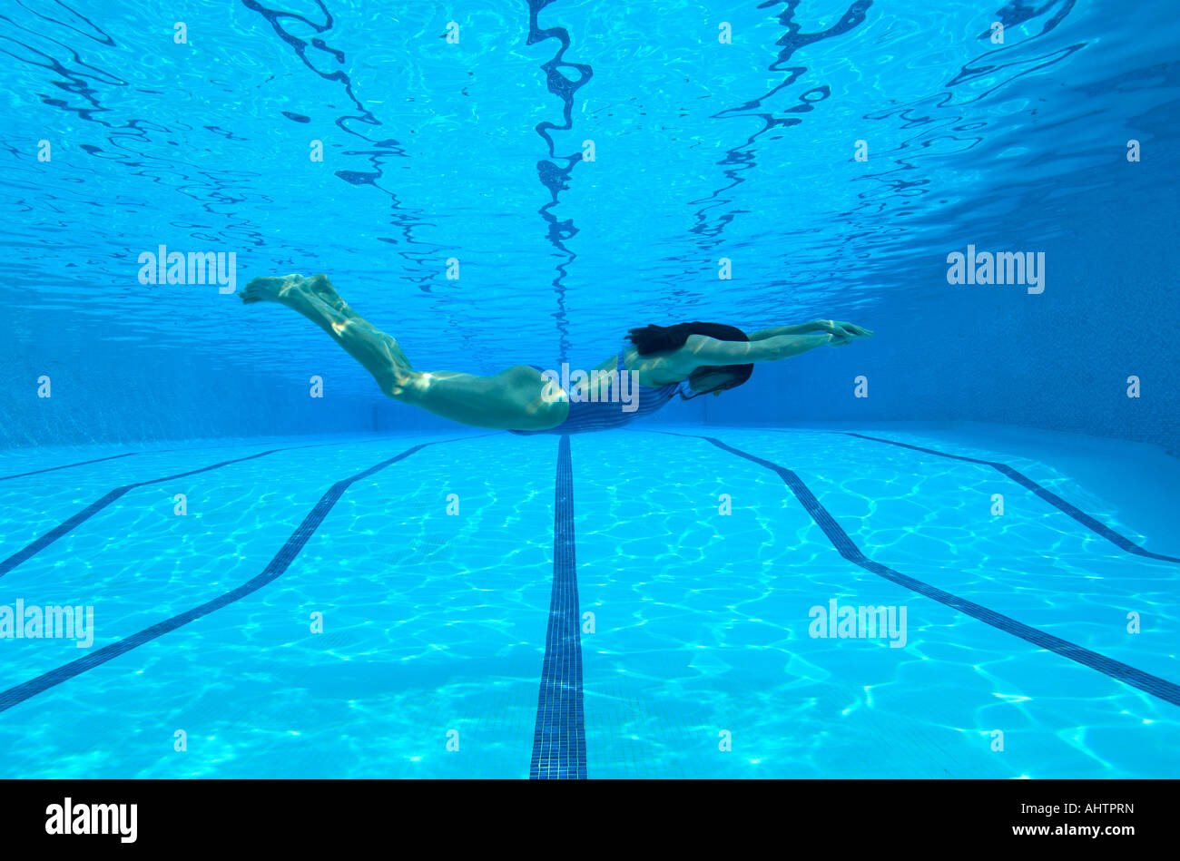 Woman swimming in pool, underwater view Stock Photo - Alamy