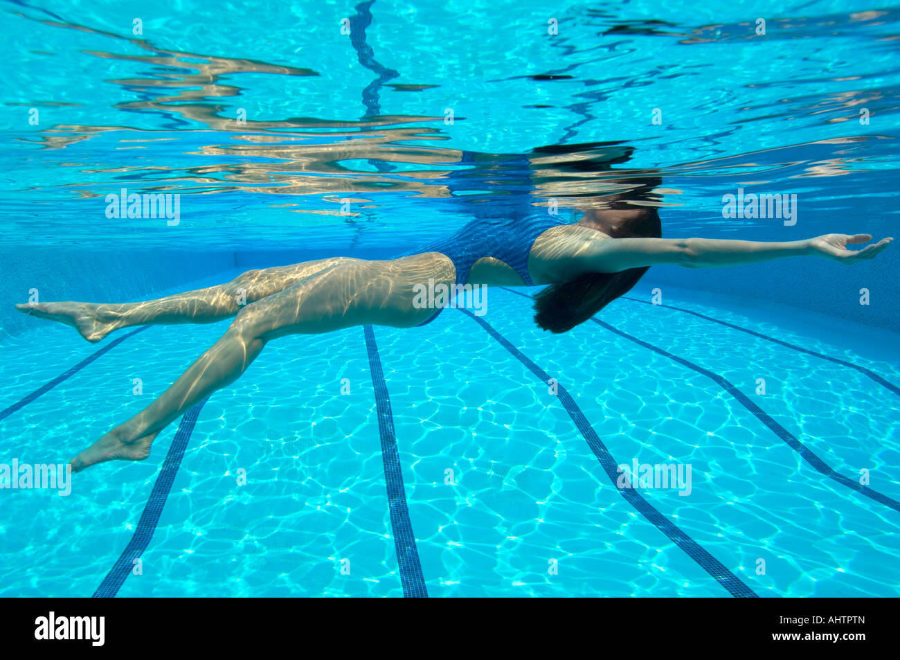 Woman swimming in pool, underwater view Stock Photo - Alamy, image size:1300x953
