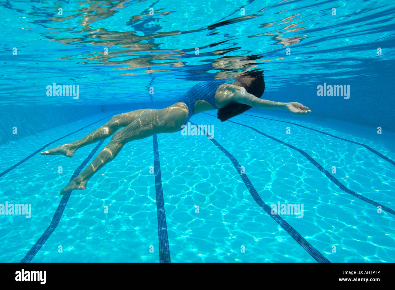 Woman swimming in pool, underwater view Stock Photo - Alamy