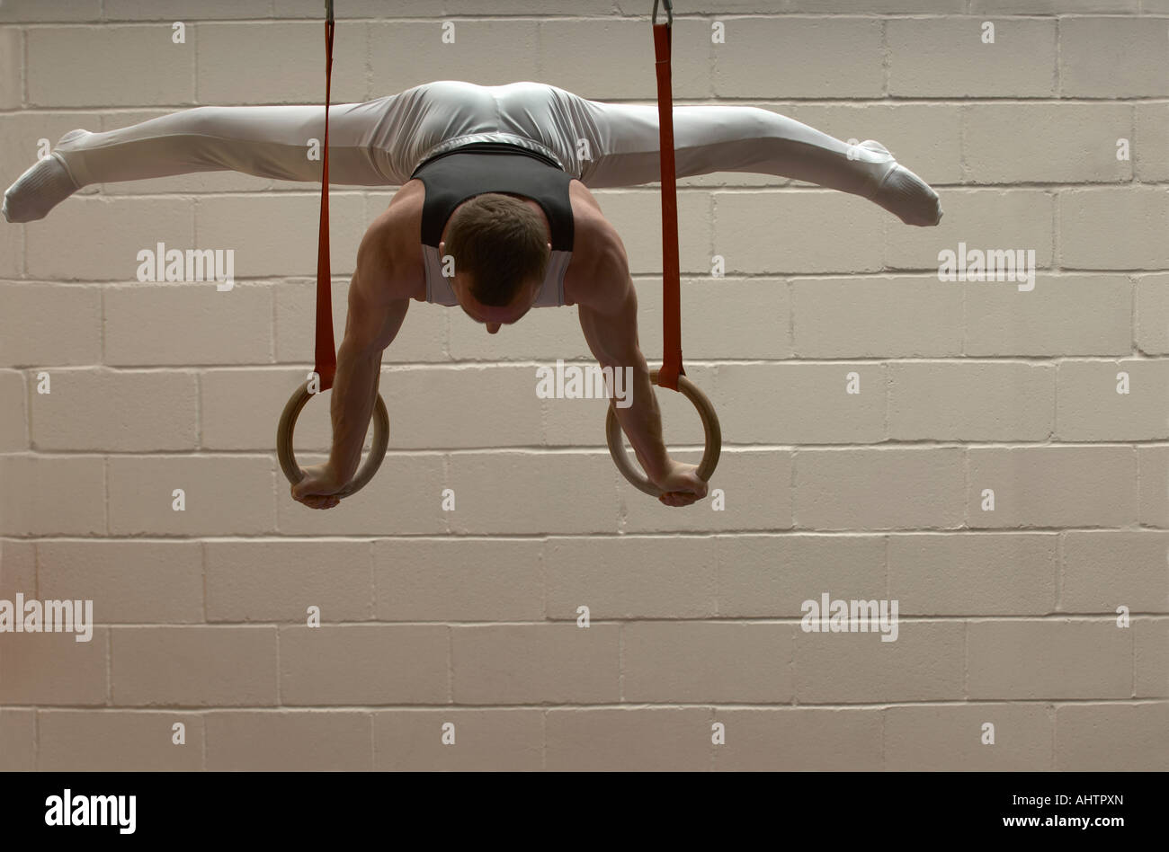 Male gymnast performing on rings Stock Photo Alamy