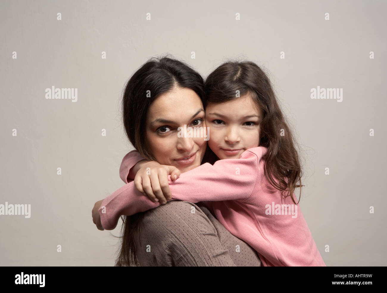 Mother embracing daughter (5-7), portrait Stock Photo