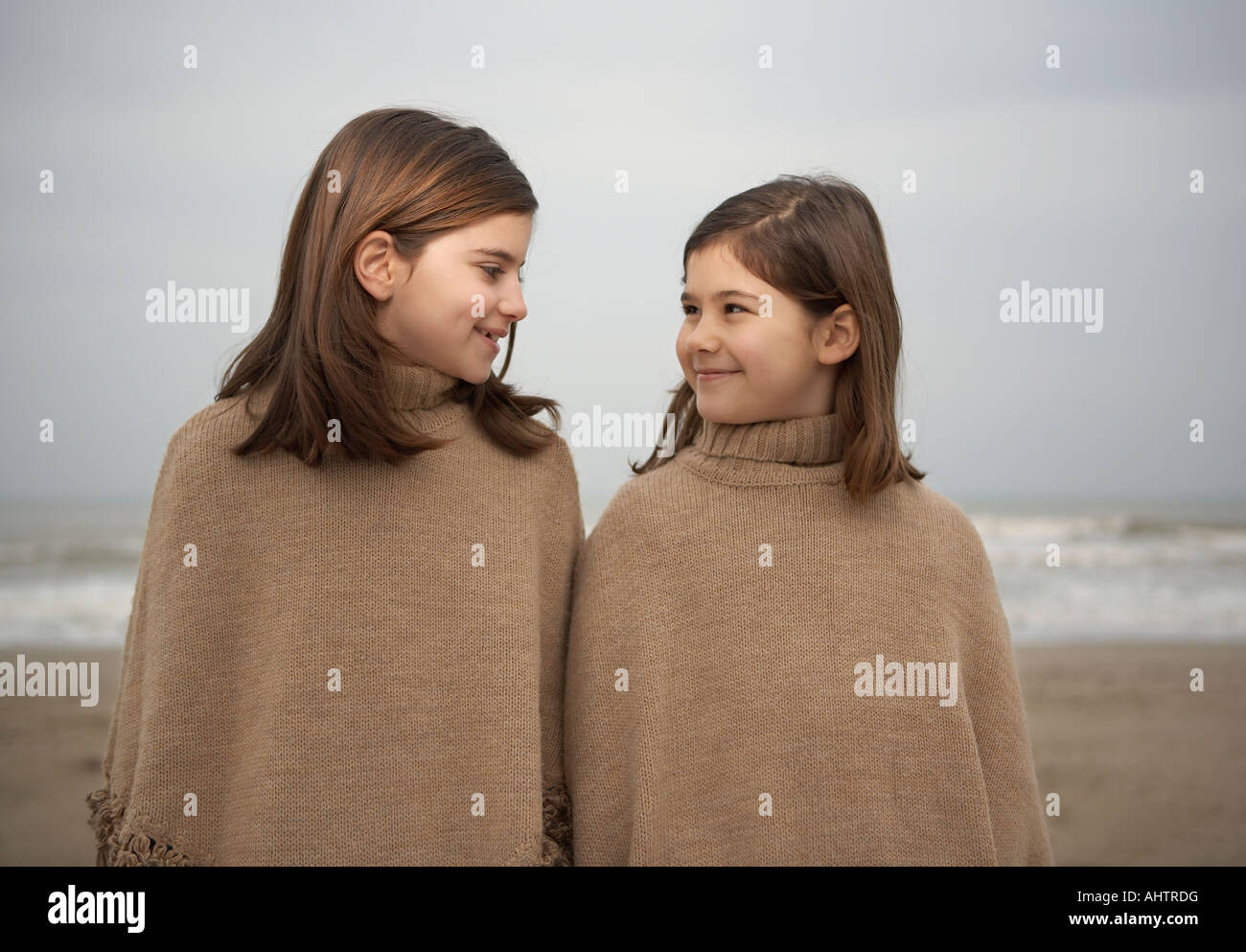 Girls (6-11) smiling on beach Stock Photo