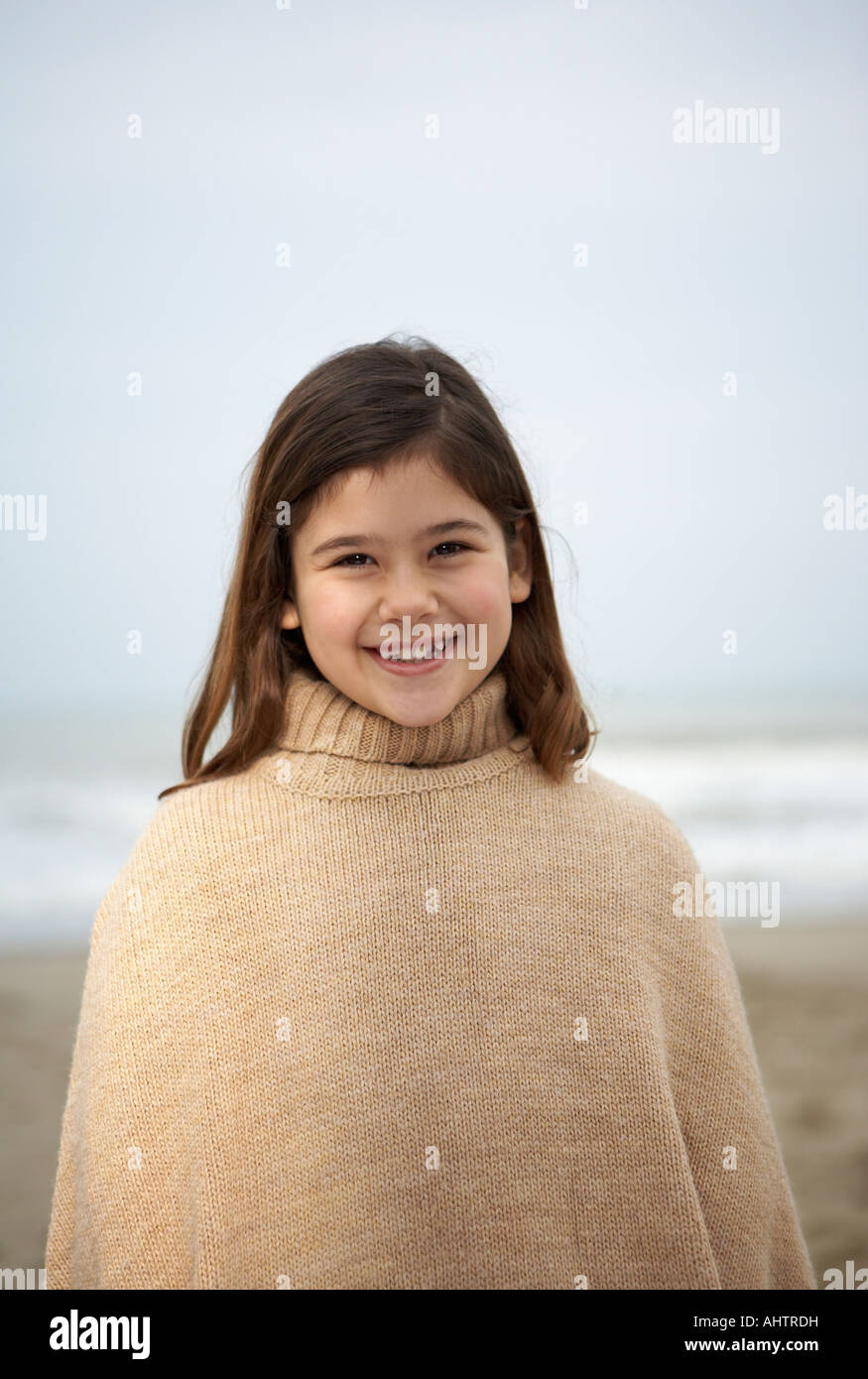 Girl (6-8) on beach, portrait Stock Photo