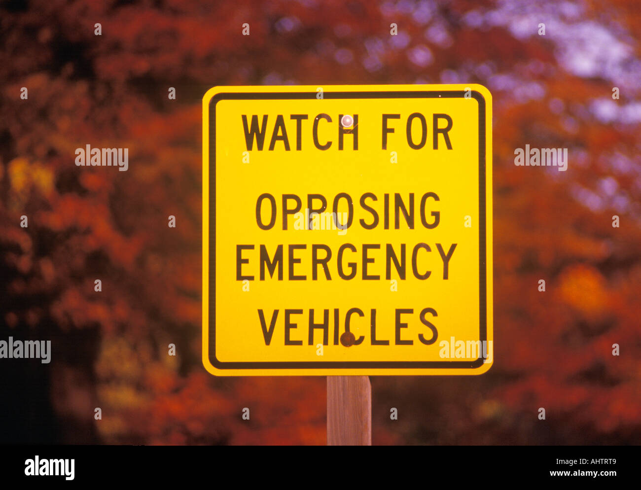 A sign that reads Watch for opposing emergency vehicles Stock Photo