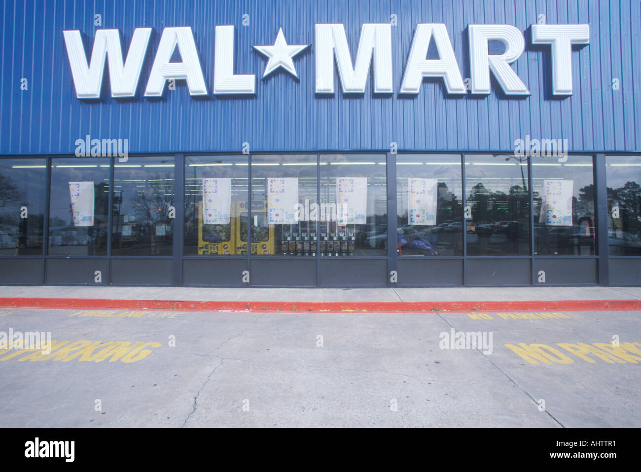 Wal Mart Supercenter Store front entrance and parking lot in Southeast walmart supercenter vision center phone number