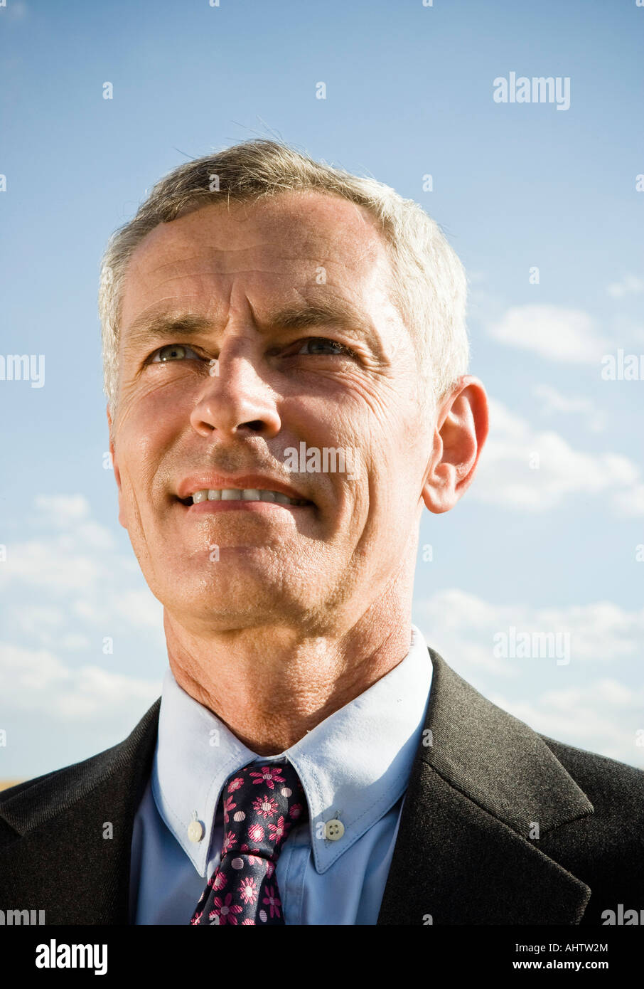 Businessman outdoors smiling Stock Photo - Alamy