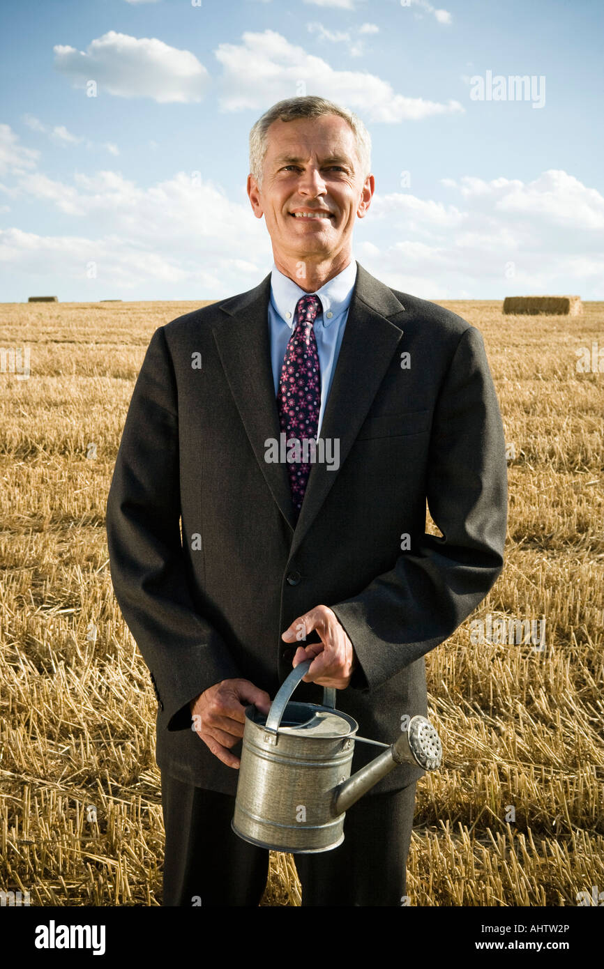 Businessman standing grain field hi-res stock photography and images ...