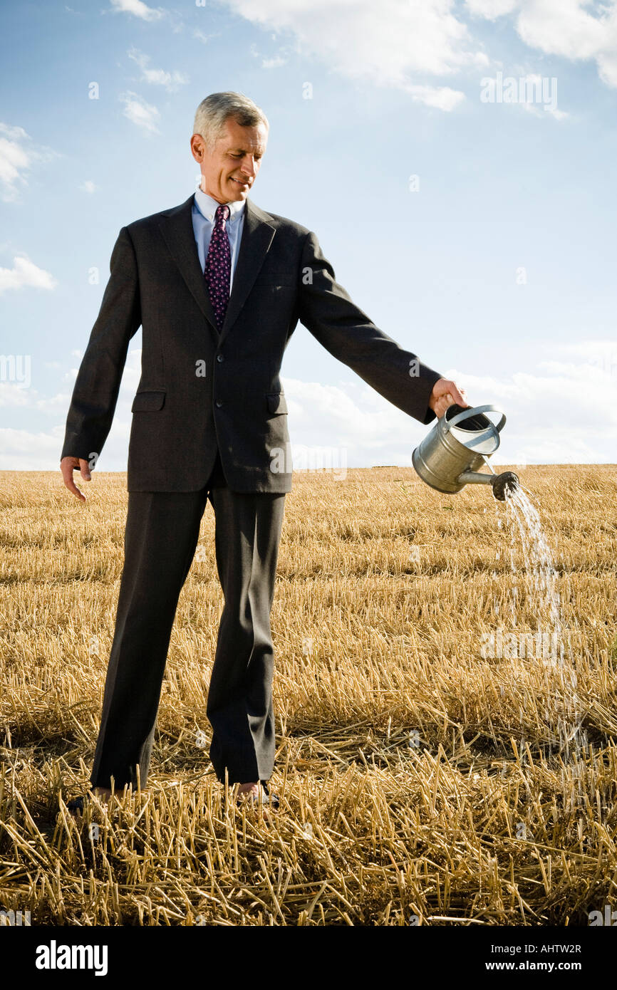 Businessman standing grain field hi-res stock photography and images ...