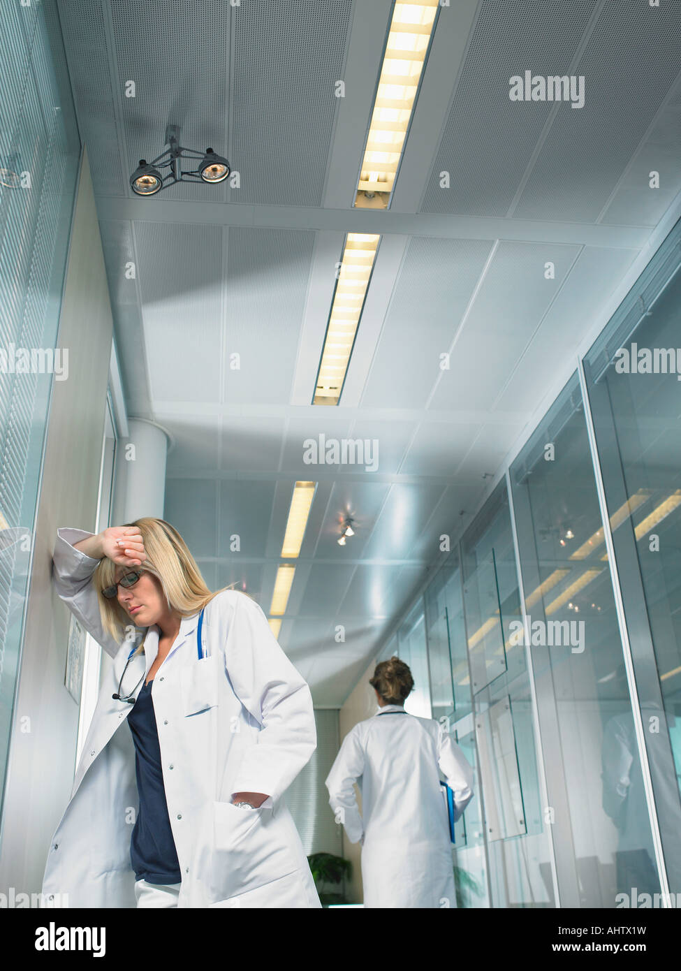 Doctor walking away rear view hi-res stock photography and images - Alamy