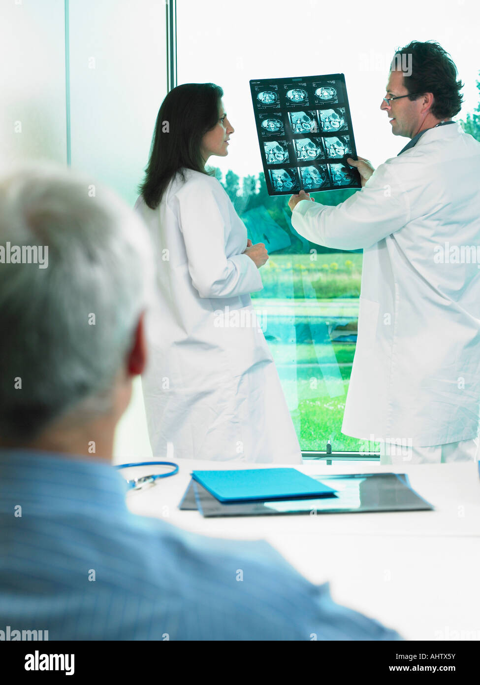 Doctor holding baby back view hi-res stock photography and images - Alamy