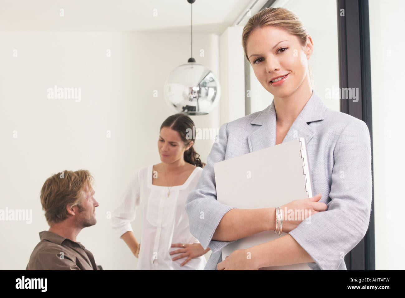 Authority leadership standing looking down side by side holding hi-res ...