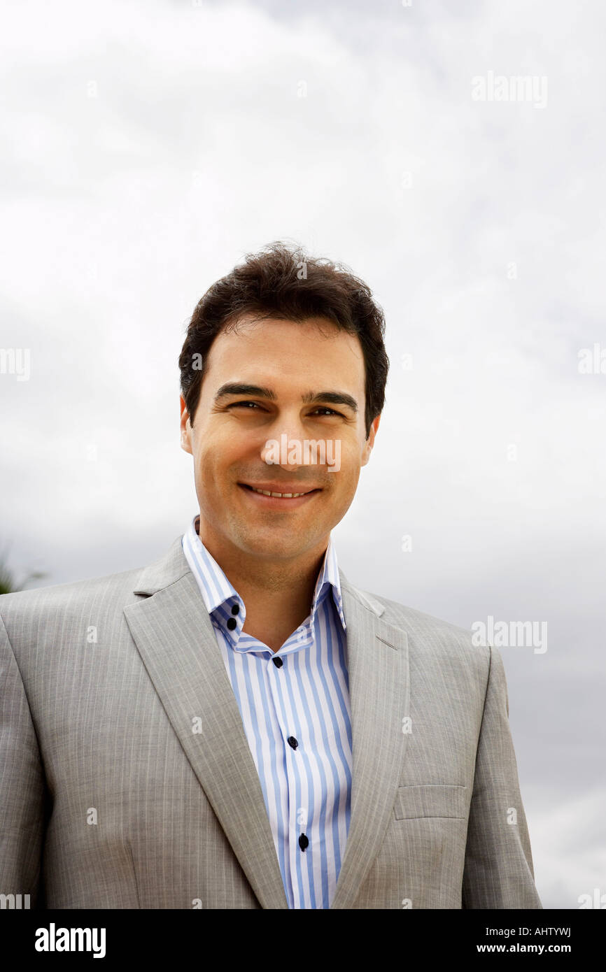 Businessman outdoors smiling Stock Photo - Alamy