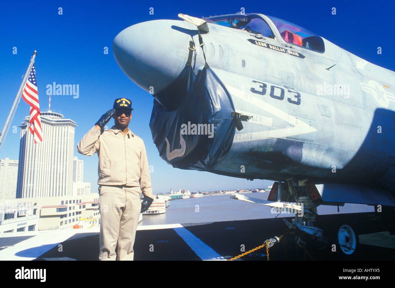Afro American Soldier Saluting by Aircraft USS Forrestal New Orleans Louisiana Stock Photo