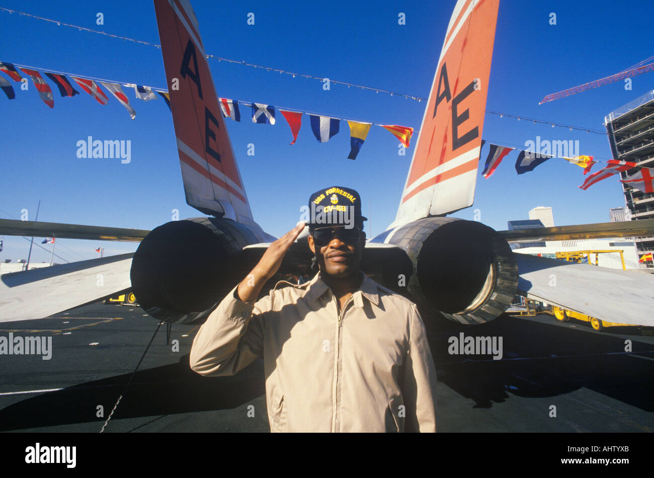 Afro American Soldier Saluting By Aircraft USS Forrestal New Orleans Louisiana Stock Photo