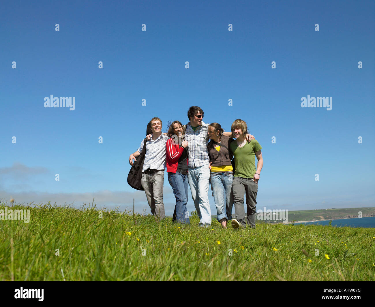 Group of young people outdoors Stock Photo - Alamy