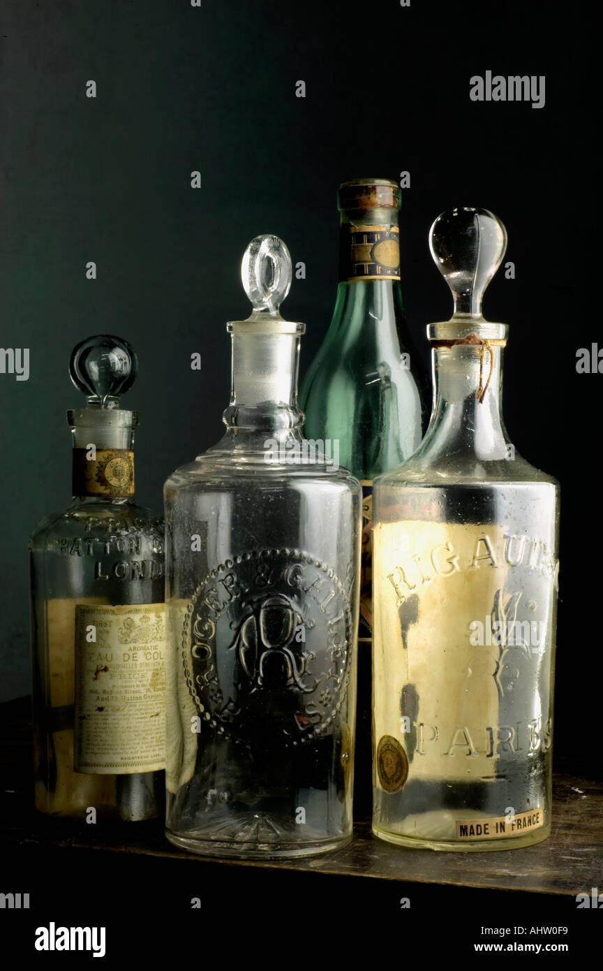 AAD 91733 Four transparent antique collectors over one hundred years old medicine glass Bottles Stock Photo
