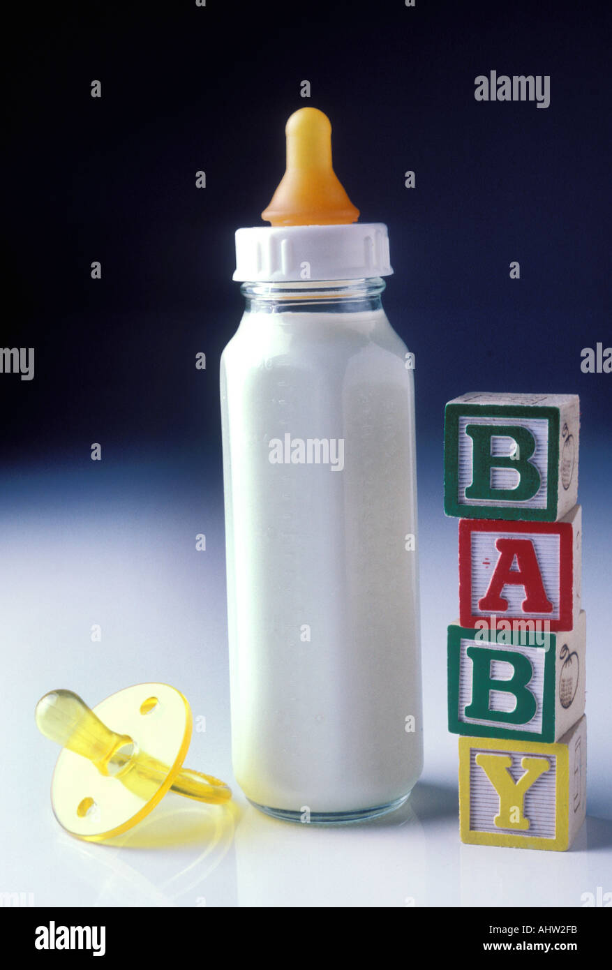 https://c8.alamy.com/comp/AHW2FB/a-bottle-of-baby-s-milk-bottle-with-toy-blocks-spelling-baby-AHW2FB.jpg