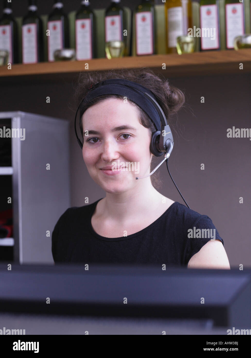 Hostess at her station in a restaurant Stock Photo Alamy