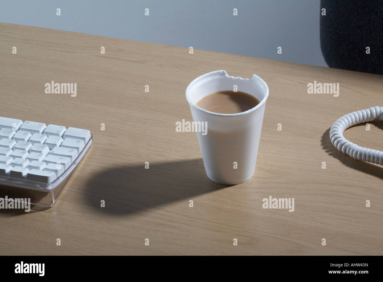A Styrofoam cup of tea with a chunk bitten out of it Stock Photo Alamy