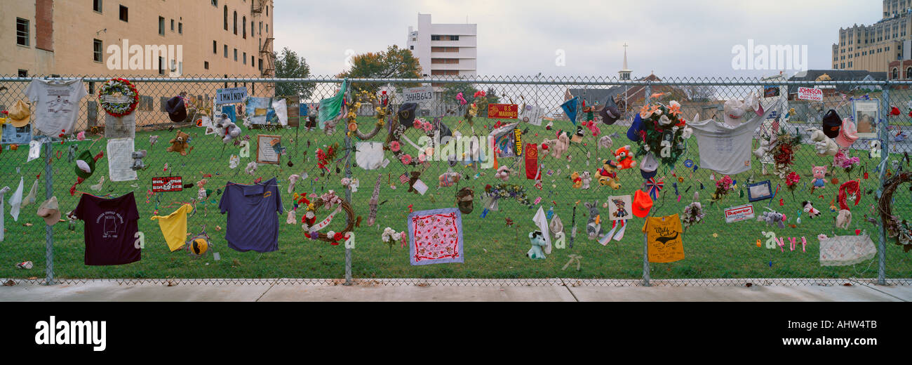 Temporary Memorial for 1995 Oklahoma City Bombing with flags pictures and personal notes on fence Stock Photo