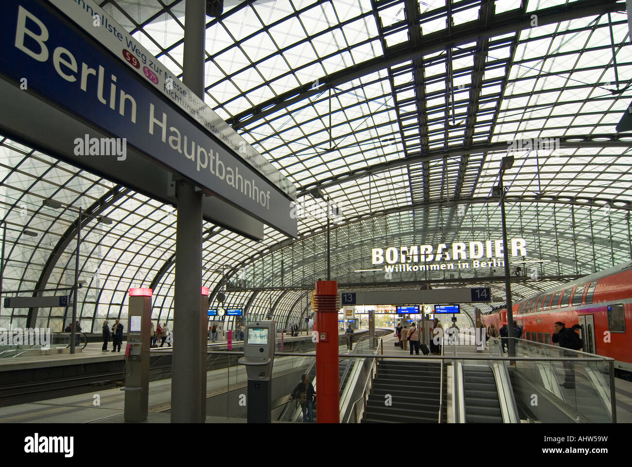 Horizontal wide angle of the busy concourse and platforms inside Berlin Hauptbahnhof station. Stock Photo