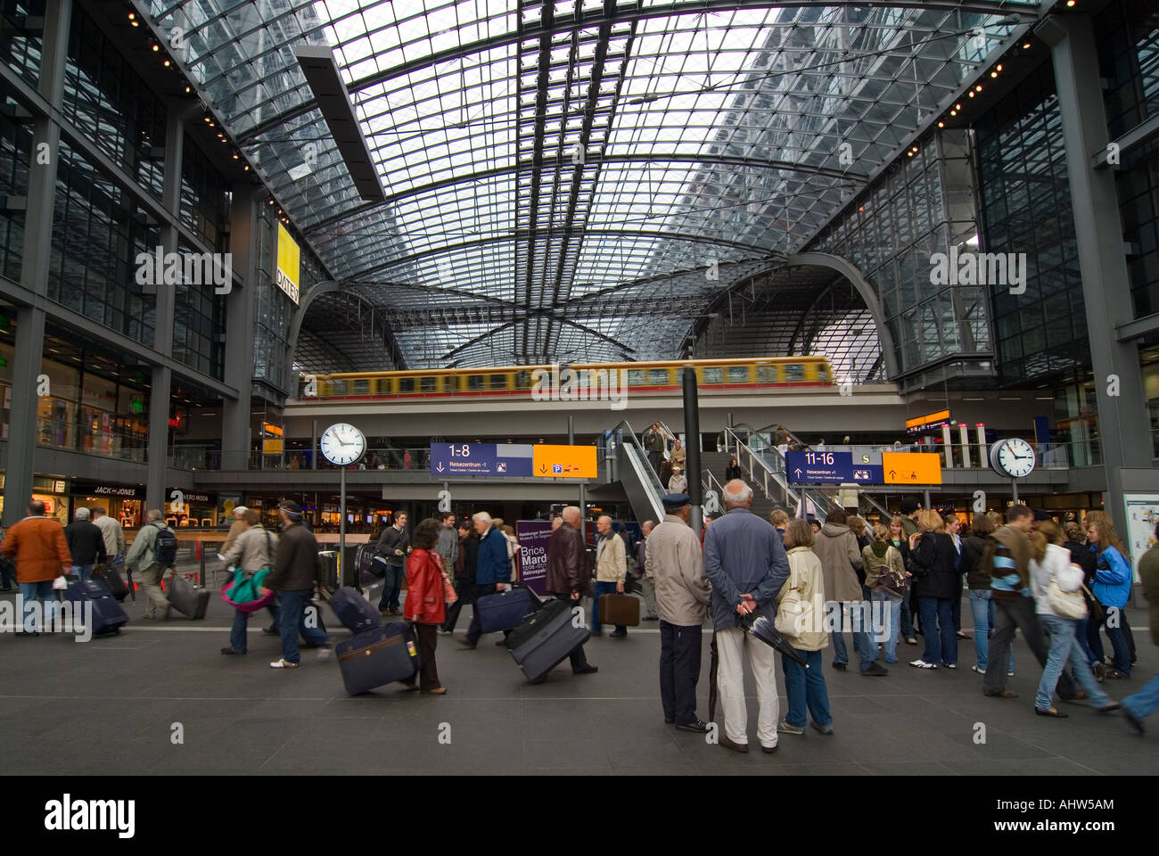 Horizontal wide angle of the busy main concourse inside Berlin Hauptbahnhof 'Berlin Central Station'. Stock Photo