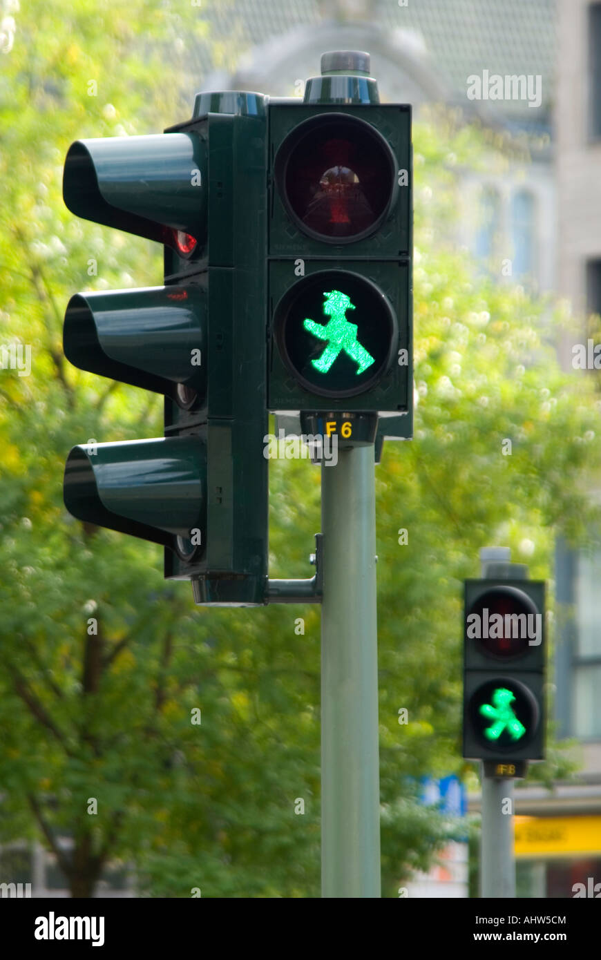 Vertical close up of the distinctly East German red/green men symbols at traffic lights in Berlin. Stock Photo
