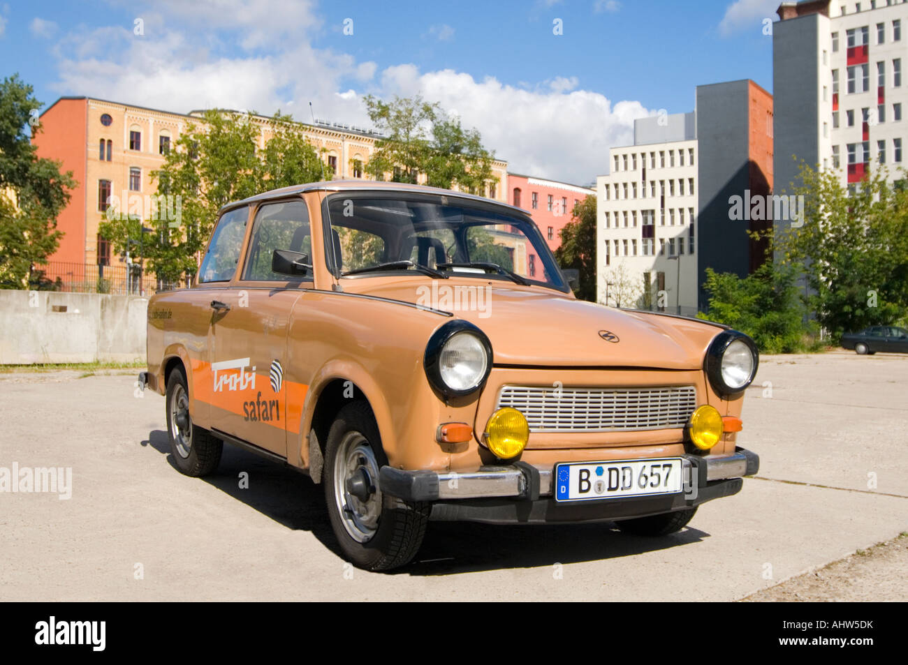 Horizontal close up of a brown vintage Trabant car, aka Trabbi or Trabi, available for hire around Berlin. Stock Photo
