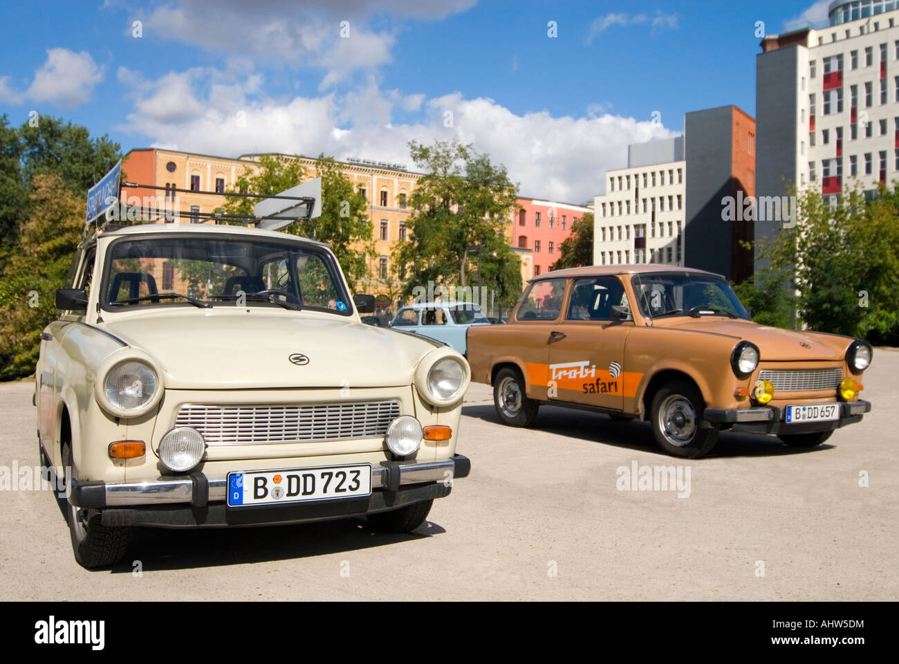 Horizontal close up of three parked vintage Trabant cars, aka Trabbi or Trabi, available for hire in Berlin. Stock Photo