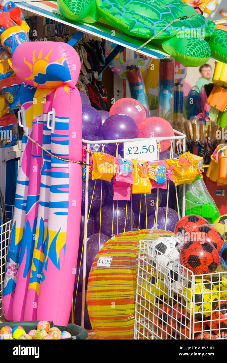 Vertical view of bright colourful plastic toys and inflatables for the