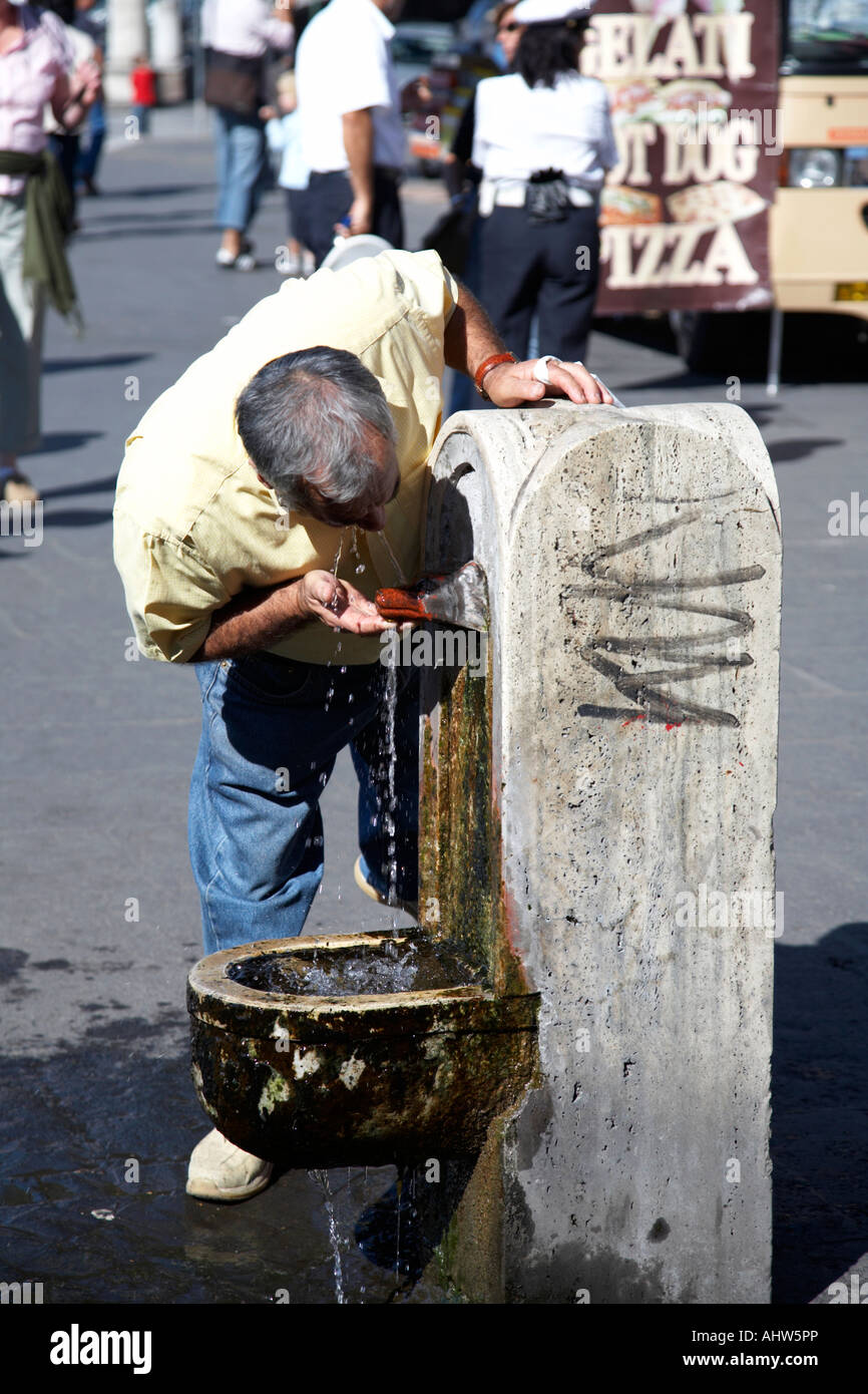 Man taking some drinking water from one of the many street fountains