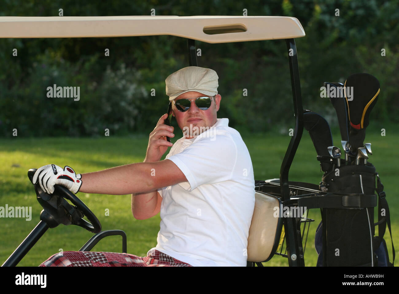 American golf courses golfer man calling on cell phone using mobil