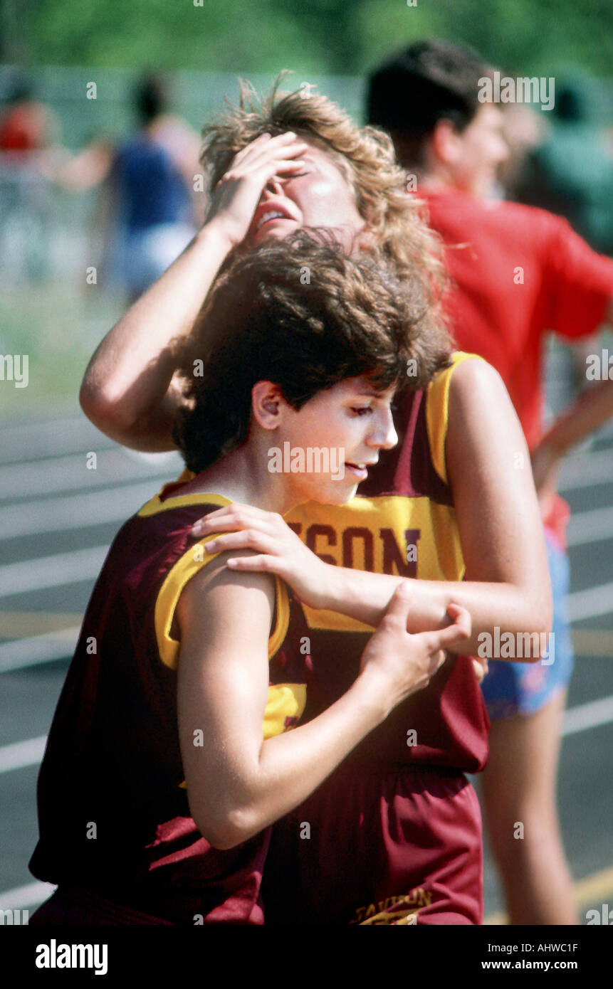 Female track runner shows total exhaustion after a maximum effort Stock Photo