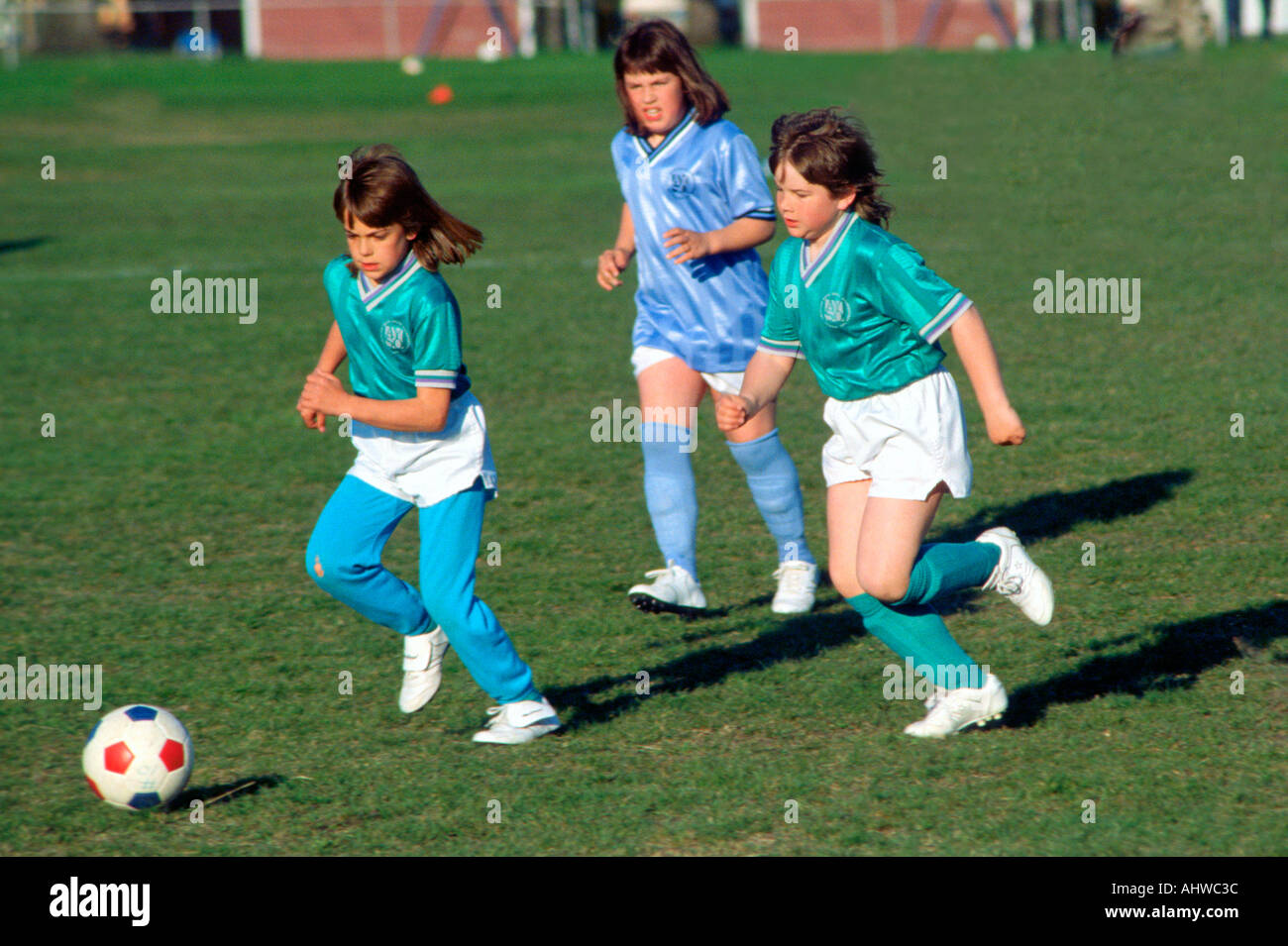 Girls 9 to 11 years old play organized soccer Stock Photo