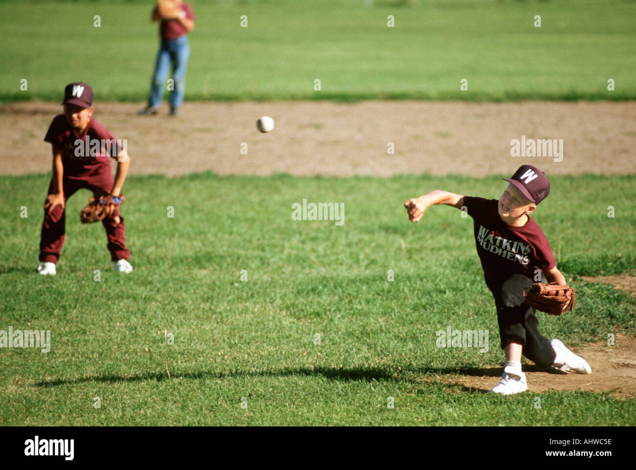 Little league Baseball Action boy throwing Pitching baseball ball Stock
