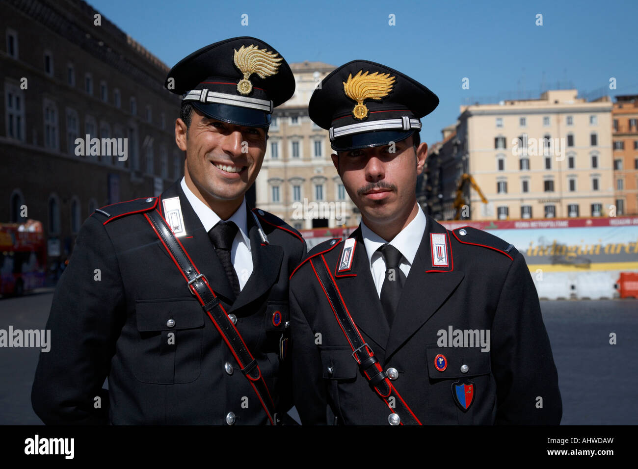 head and shoulders of Two Arma Dei Carabinieri Italian police officers on duty in Piazza Venezia Rome Lazio Italy Stock Photo