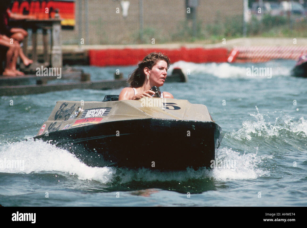 Wisconsin Dells water park female races around a pool of water in a