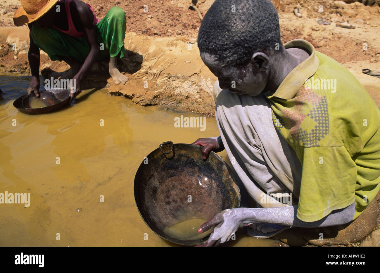 Young boy panning for gold at artisanal gold mines, Essakane, Burkina Faso Stock Photo