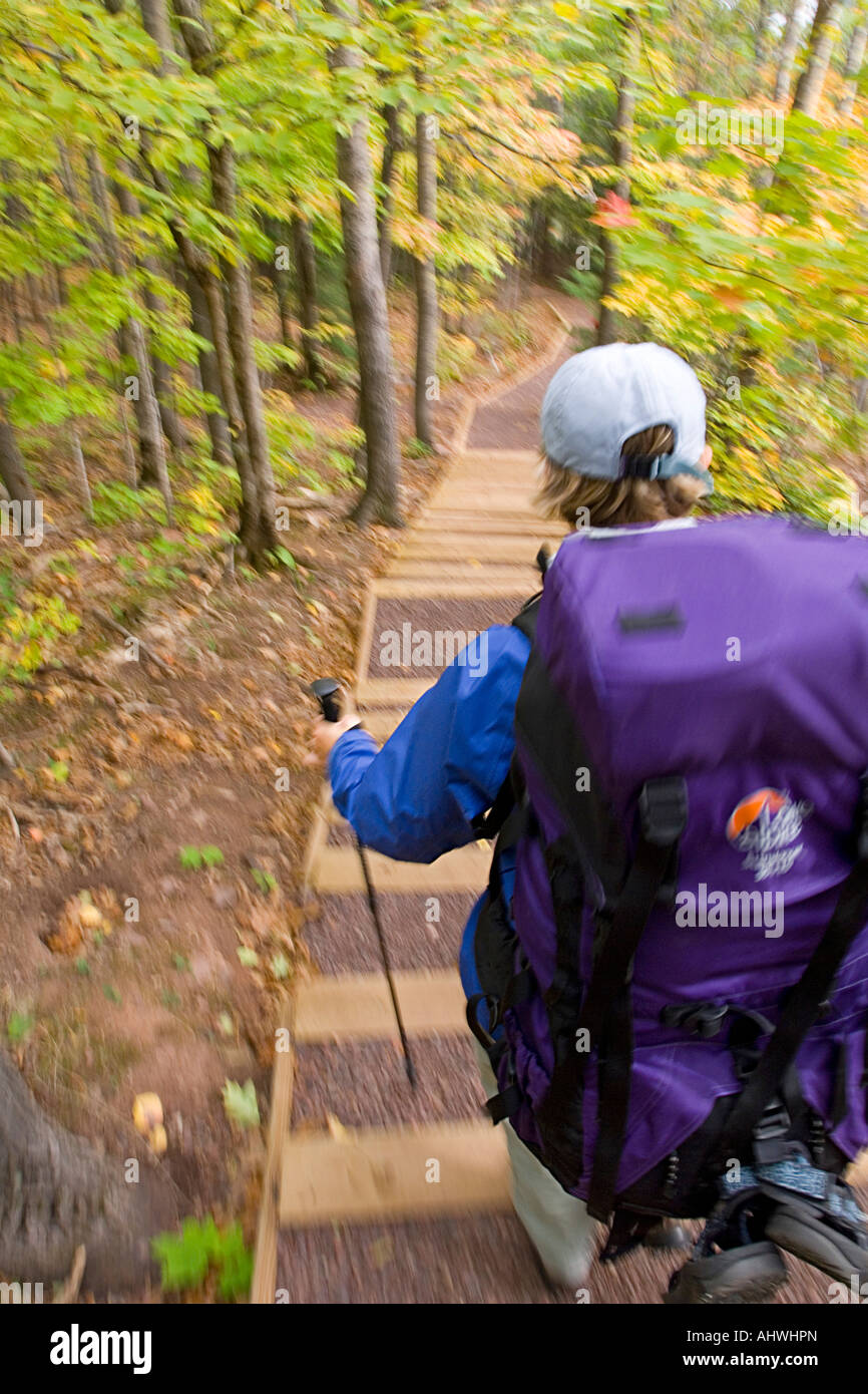 A backpacker in fall at Porcupine Mountains State Park in Michigan s