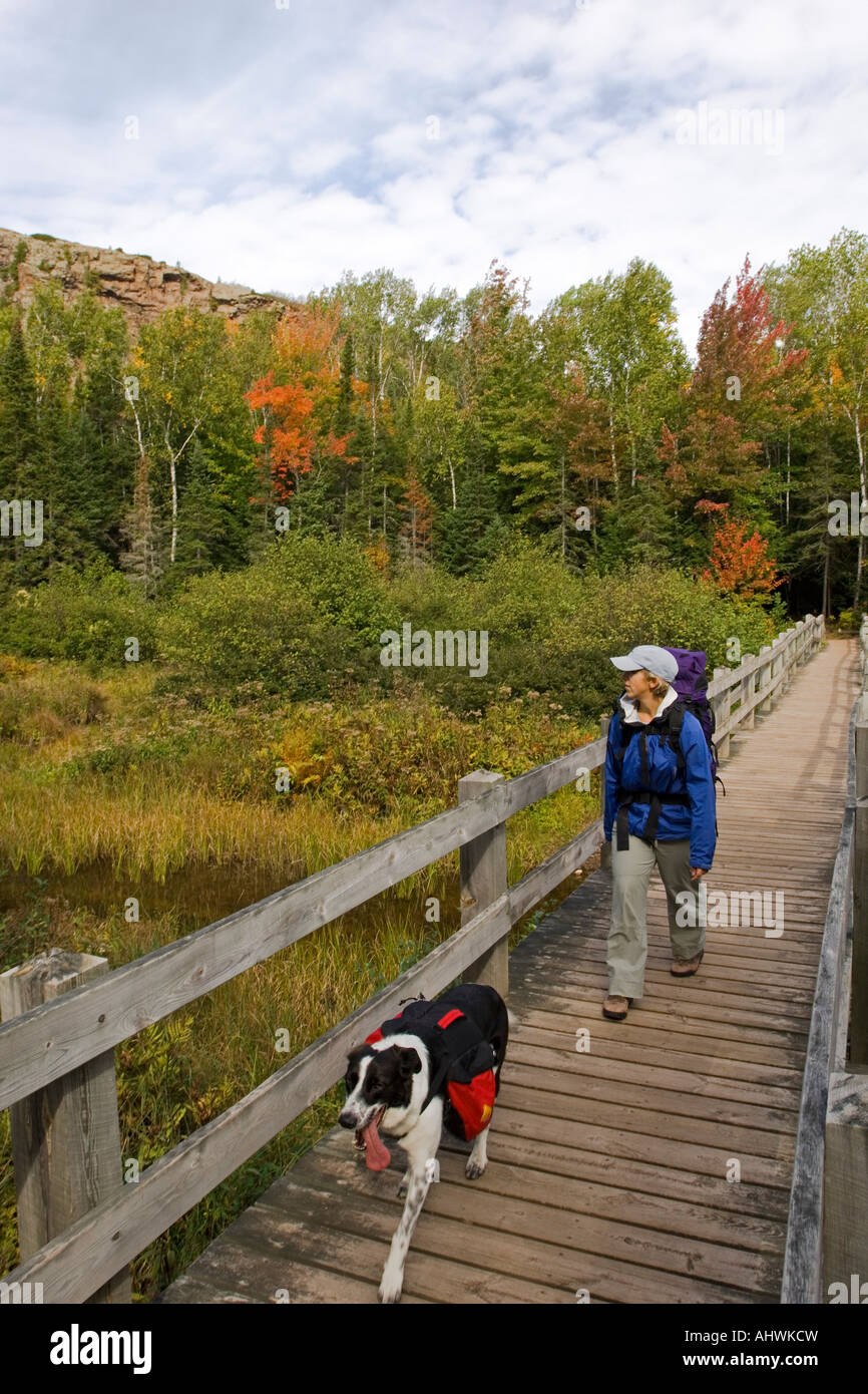 A backpacker in fall at Porcupine Mountains State Park in Michigan s