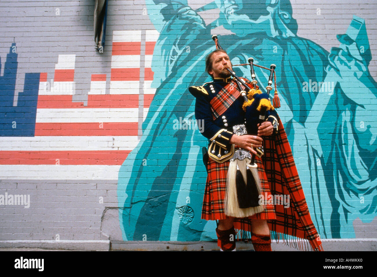 Man playing bagpipes at St Patrick s Day parade New York city Stock Photo